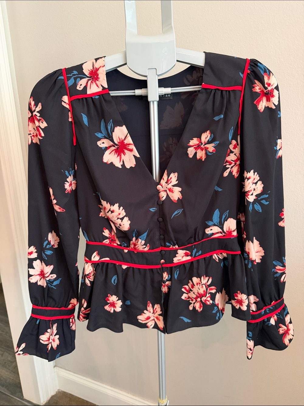 Adelyn Rae Black Floral V-Neck Peplum Blouse with Pink and Blue Accents
